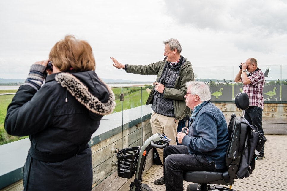 Visitors on roof of accessibility tower at slimbridge