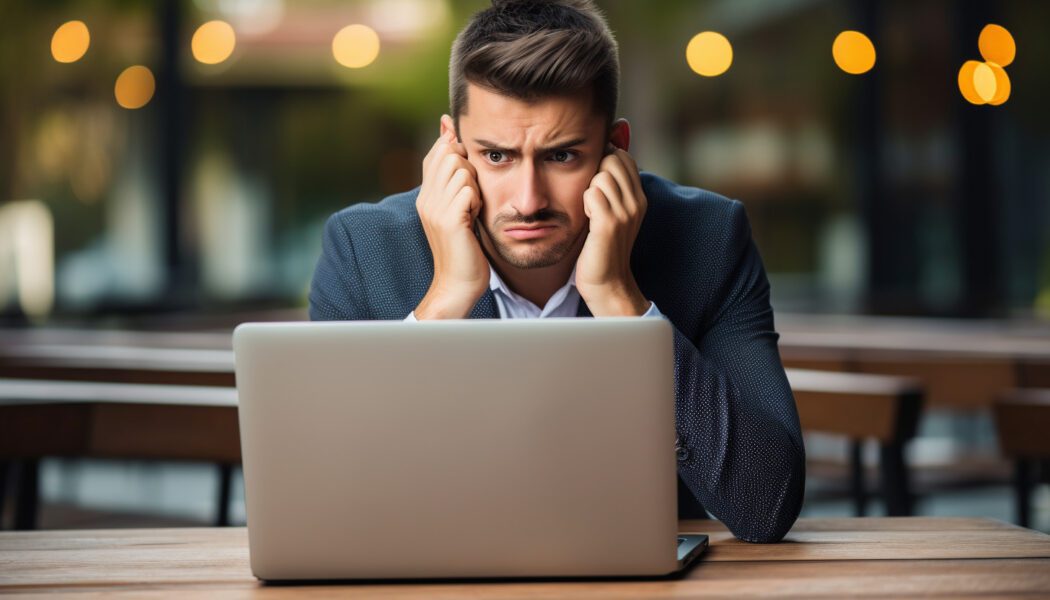 Frustrated man on laptop