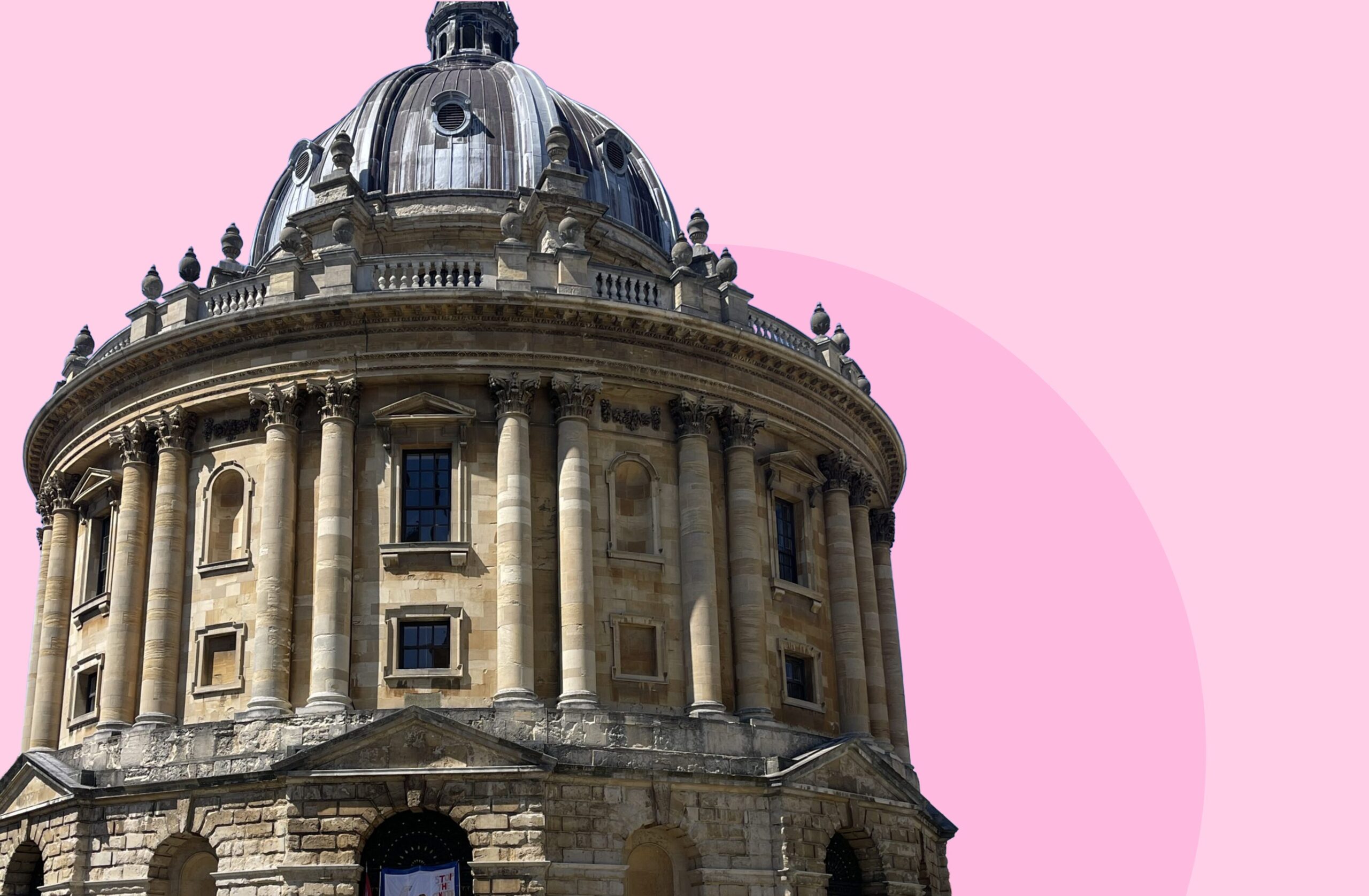 Photograph of the Radcliffe Camera in Oxford, an 18th-century circular library with a grand dome, shown against a pink background