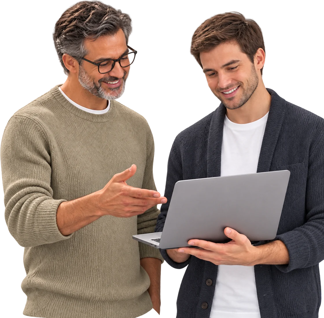 Two men smiling as they look at a laptop, one pointing at the screen