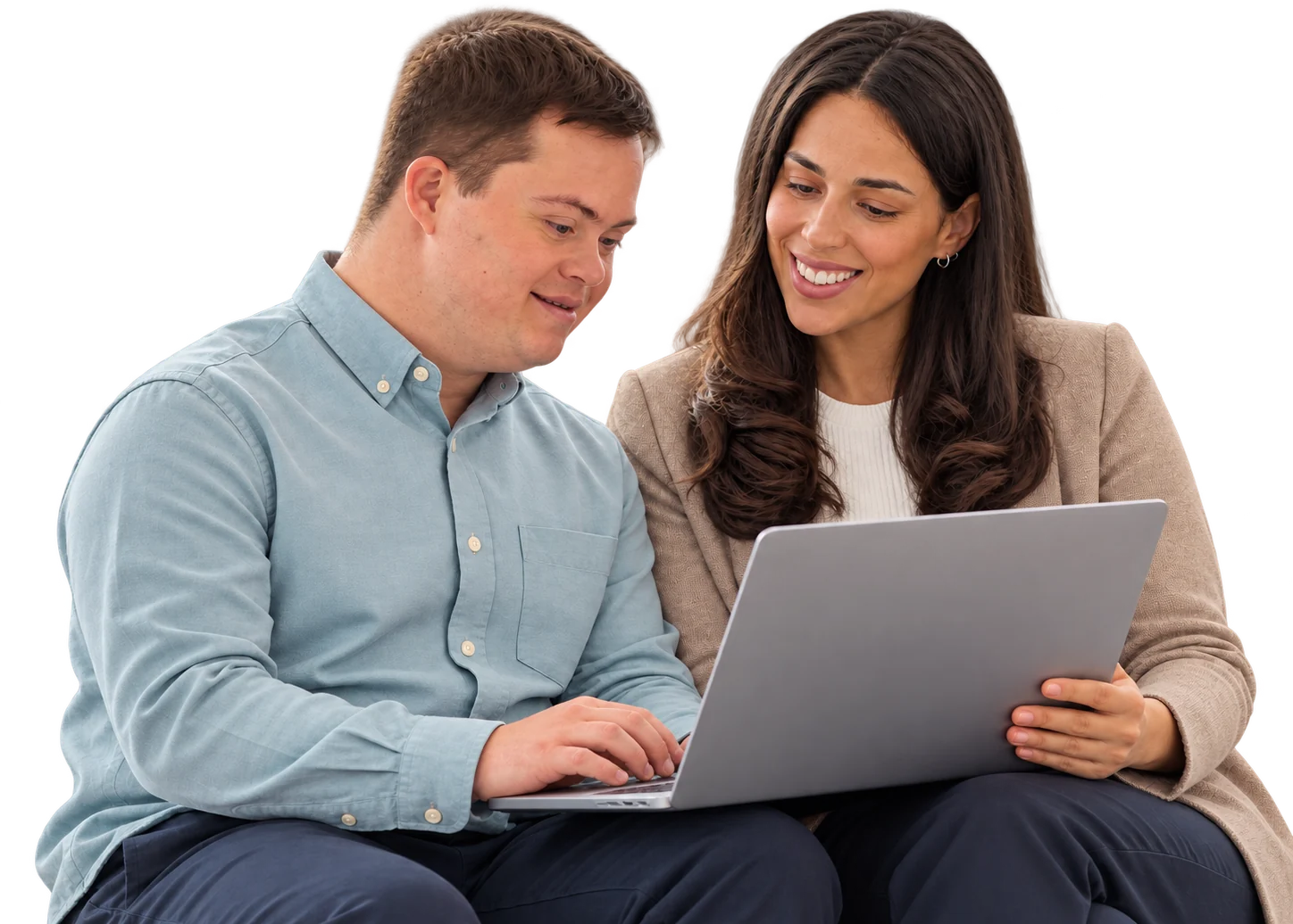 A man with Down syndrome and a woman smiling as they look at a laptop together